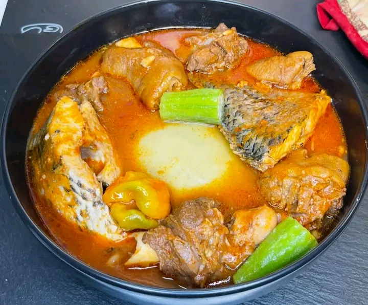 Fufu with Light Soup and Tilapia with Chicken 